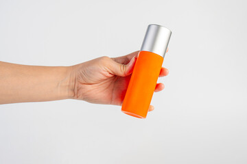 Skin care or sunscreen cosmetic and hand on white background.