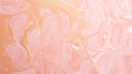 Fototapeta premium Swirling pink and gold liquid abstract image