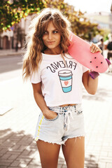 Beautiful cute blond teenager model without makeup in summer hipster white clothes with pink penny...