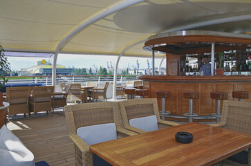 Outdoor promenade boat sun deck onboard modern luxury cruiseship cruise ship yacht liner with teak...