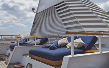 Outdoor promenade boat sun deck onboard modern luxury cruiseship cruise ship yacht liner with teak...