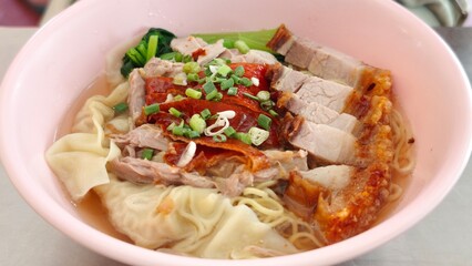 Wonton noodle with red pork and crispy pork.