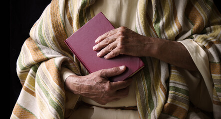 Old man holding a book