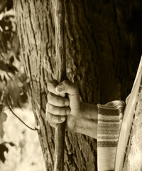 Man's hand with old cane
