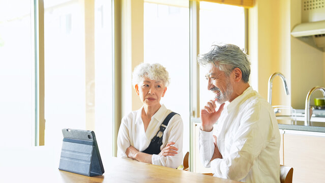 Senior couple looking at a tablet together