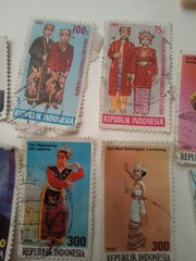 
A Collection of Colorful Indonesian Postage Stamps Arranged Closely Together

