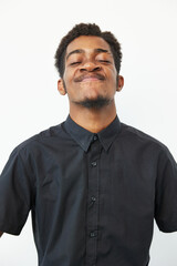 Happy African American man smiling confidently, dressed in a black shirt, showcasing a joyful...