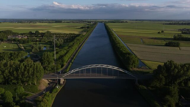 Amsterdam rhine canal, bridge, infrastructure and waterway near Weesp, The Netherlands. Aerial video.