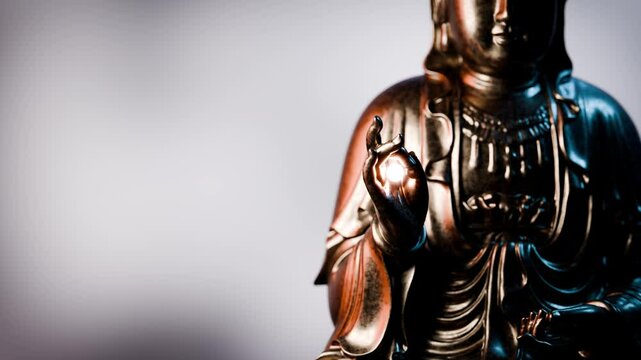 Golden buddha statue presenting vitarka mudra gesture, symbolizing teaching and discussion
