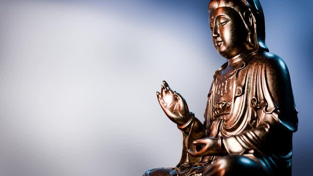 Golden buddha statue presenting vitarka mudra gesture, symbolizing teaching and discussion