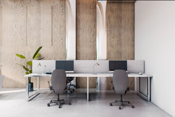 Modern empty office interior with wooden wall, dual desks, and computer setups in a contemporary corporate workspace setting. 3D Rendering
