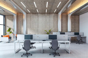 Fototapeta premium Modern empty office interior with sleek desks, computer setups, wooden wall panels, and natural daylight in contemporary corporate workspace. 3D Rendering