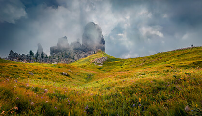 Gloomy summer view of Cinque Torri mountain cliff. Majestic morning scene of Dolomite Alps, Cortina d'Ampezzo location, Province of Belluno, Italy, Europe. Beauty of nature concept background.