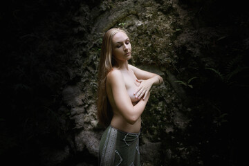 Woman in the forest. Enjoying nature.