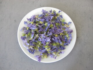 Dried mallow flowers on a small plate