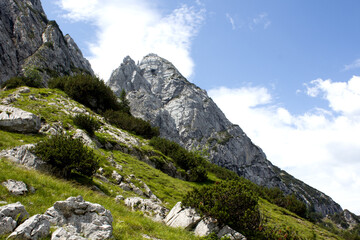 Majestic mountain landscape in Tyrol Austria showcasing rocky peaks and lush greenery under a...
