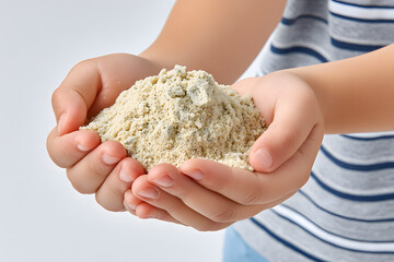 Young child cradles a mound of dry, light tan sandy material in their small hands, highlighting texture and childhood innocence. Ai Generated Images