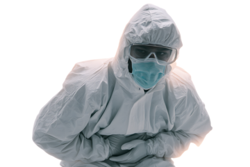 Health worker in PPE holds stomach.