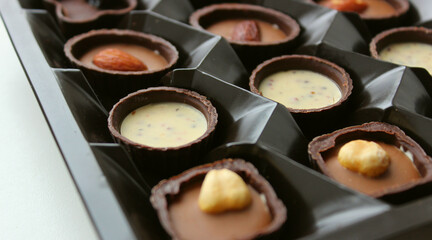 Delicious confectionery manufacture. Luxury chocolate candies with various flavor closeup stock photo 
