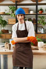 Handsome young man nurturing plants with care in a bright and lively studio environment