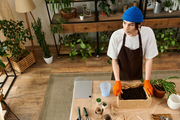 Handsome young man cultivating plants in a bright, inviting studio space