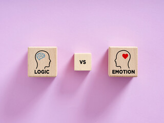 Logic vs Emotion concept with wooden blocks on pink background