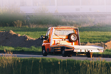 Tow truck transporting nothing after emergency call