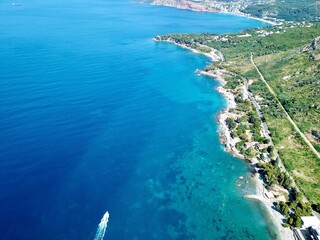 A drone photo of the beautiful Mediterranean Sea and the view from afar of the bay of Sutomore in...