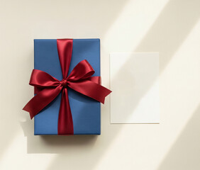 Elegant Gift Box with Red Ribbon and blank paper on White Background