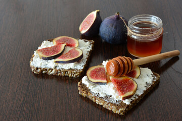 Fig and Honey Toast isolated on dark wooden background