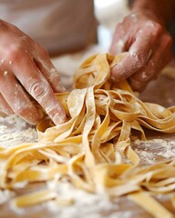 Man is making pasta and his hands are covered in flour