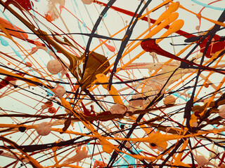 Abstract background of acrylic latex paint. Brown, red, white and black spots of flowing splattered...