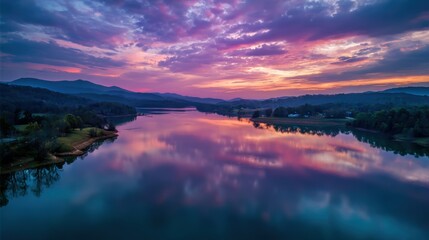 Fototapeta premium High angle of a calm lake reflecting colorful sky at twilight