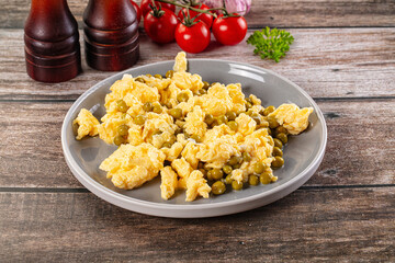 Scrambled egg omelet with green peas