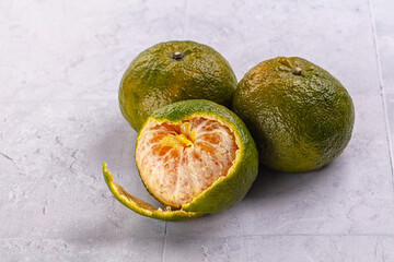Ripe green organic orange citrus
