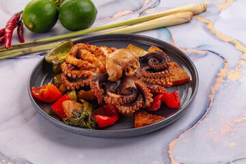 Gourmet grilled octopus with vegetables © Andrei Starostin