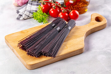 Raw black rice noodles lines