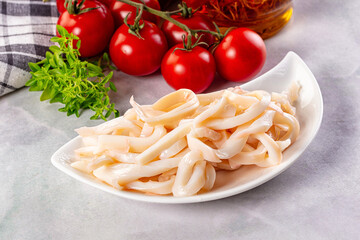 Canned marinated squid rings heap