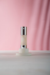Cosmetics tube mockup on concrete stand, pink background. Mockup, no brand, no label template. Eye Serum Whitening, concealer