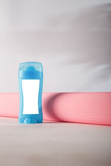 Deodorant antiperspirant mockup with blank label, no brand. Blue cosmetics container template on white background. Beauty product advertising banner, copy space