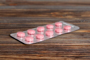 Blister package with Vitamin on color background. Medicine pills on a light background. Medicines...
