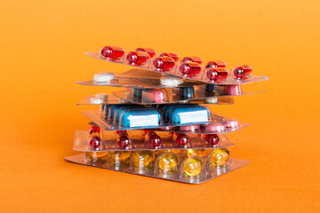 too many different pill cartridges stacked. selective Focus. Packs of blister pills with tablets....