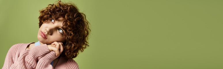 Young woman radiates confidence in stylish summer outfit against vibrant green backdrop