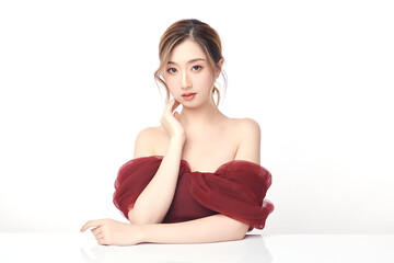 A beautiful young Asian woman with clean, fresh skin against a white background. Skincare, facial...
