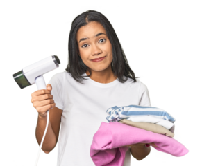 Positive Latina using a steam iron on clothes