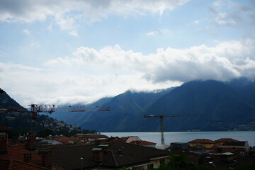 Dramatic Clouds Rolling Over Lugano with Historic Church Tower in Foreground, Ticino, Switzerland