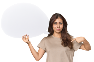 Middle Eastern woman holding comic bubble person pointing by hand to a shirt copy space, proud and confident
