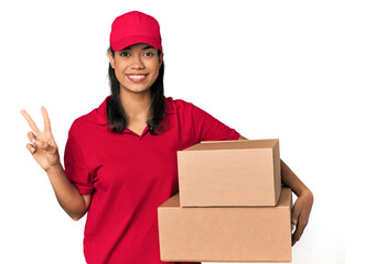 Young Filipina courier with two packages showing number two with fingers.