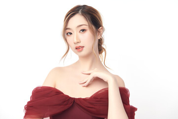 A beautiful young Asian woman with clean, fresh skin against a white background. Skincare, facial...