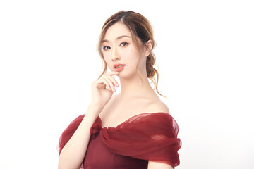 A beautiful young Asian woman with clean, fresh skin against a white background. Skincare, facial...